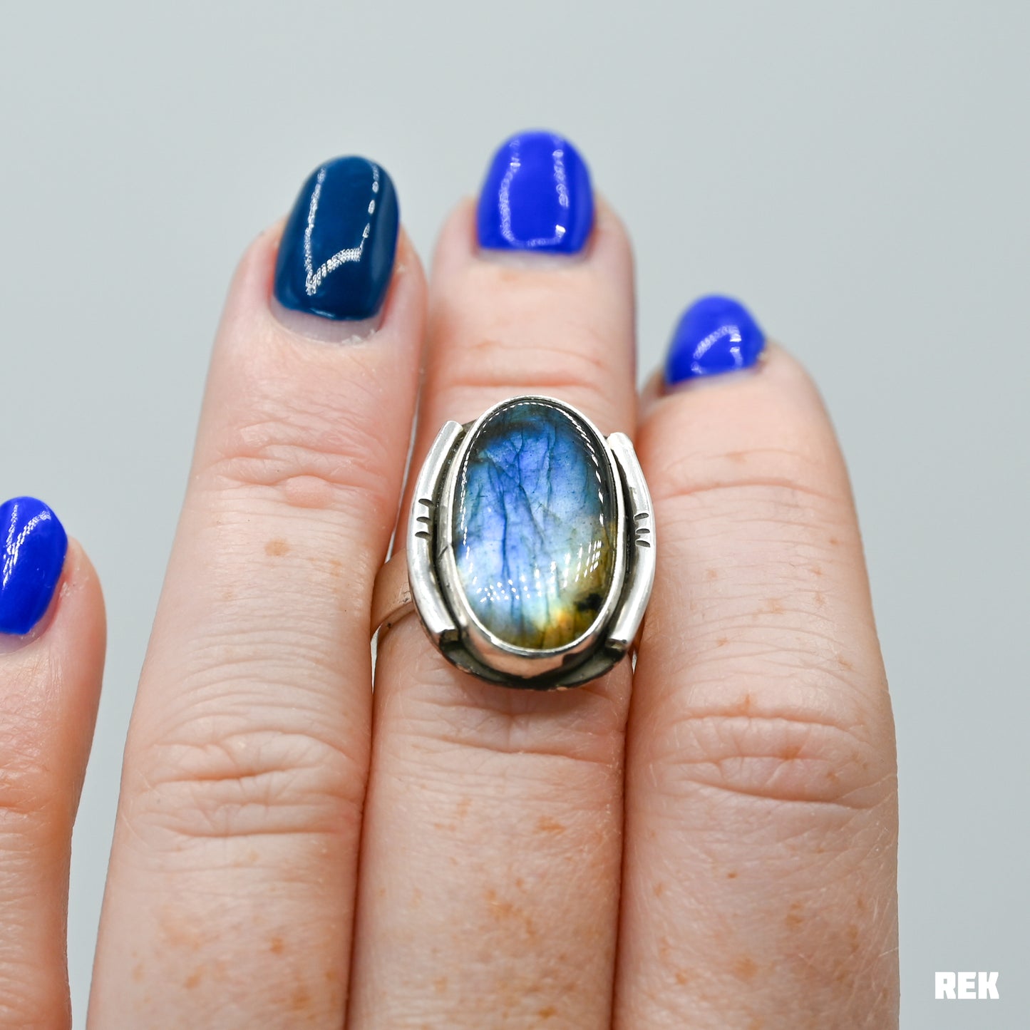 Oval labradorite with silver ornaments size 6.75