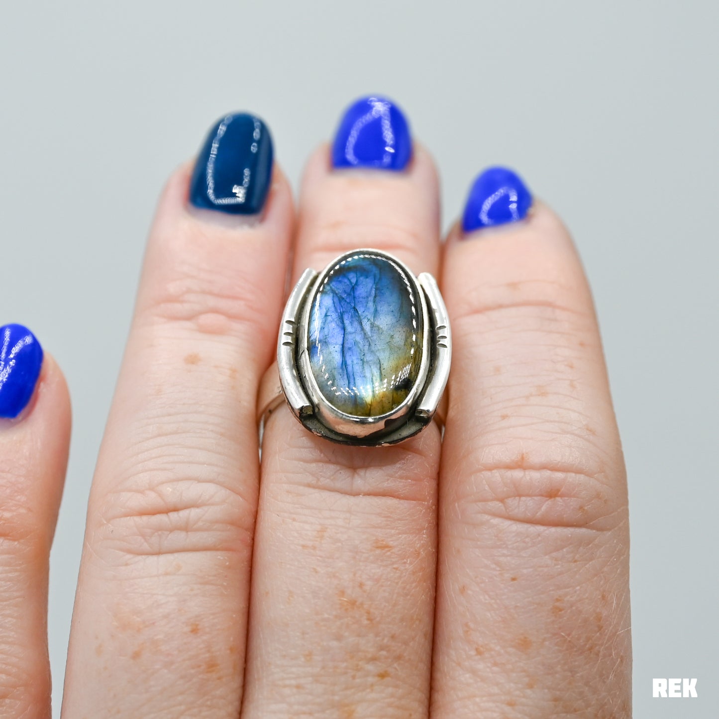 Oval labradorite with silver ornaments size 6.75