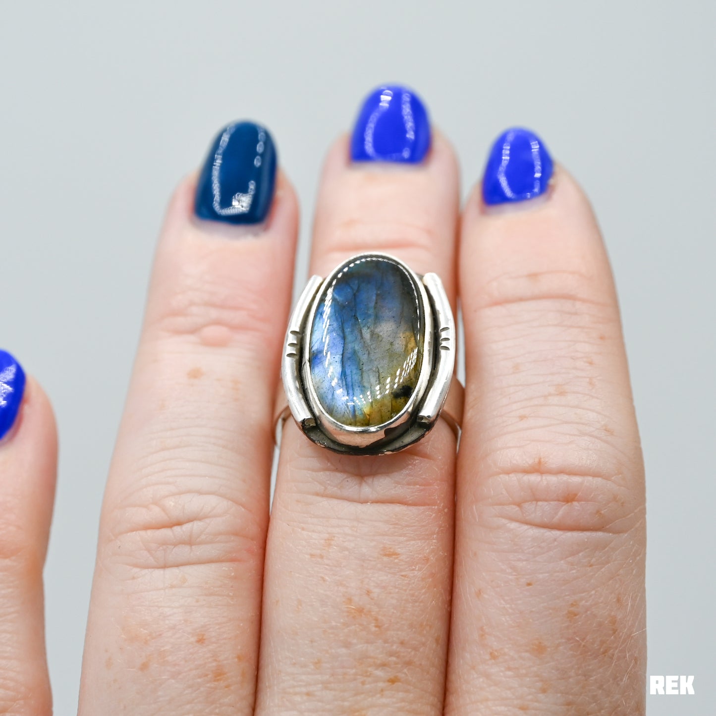 Oval labradorite with silver ornaments size 6.75