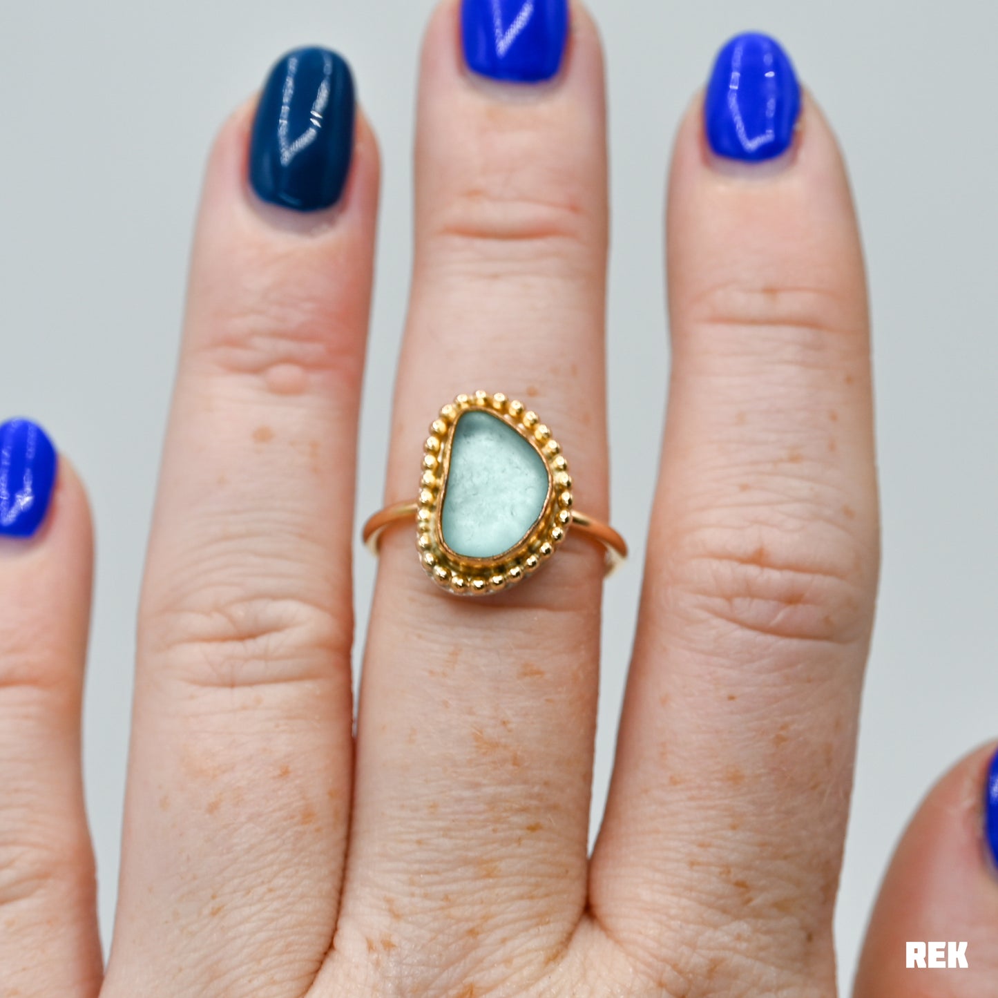 Gold fill aqua sea glass bead around size 7.5