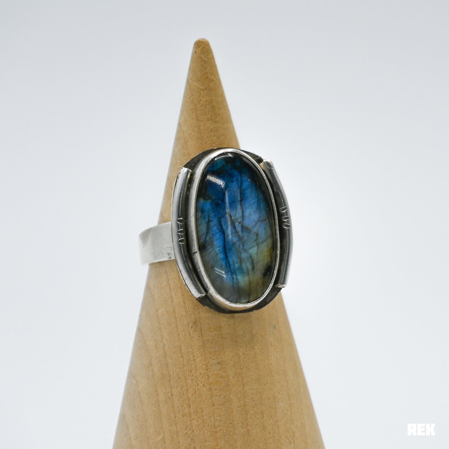 Oval labradorite with silver ornaments size 6.75