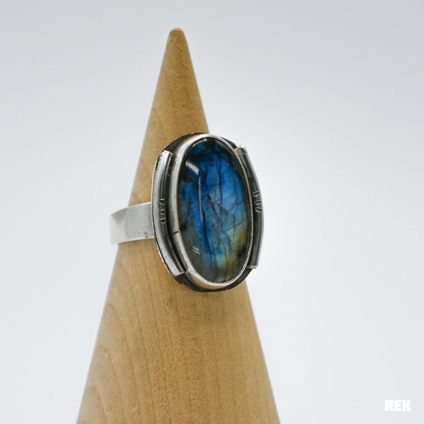 Oval labradorite with silver ornaments size 6.75