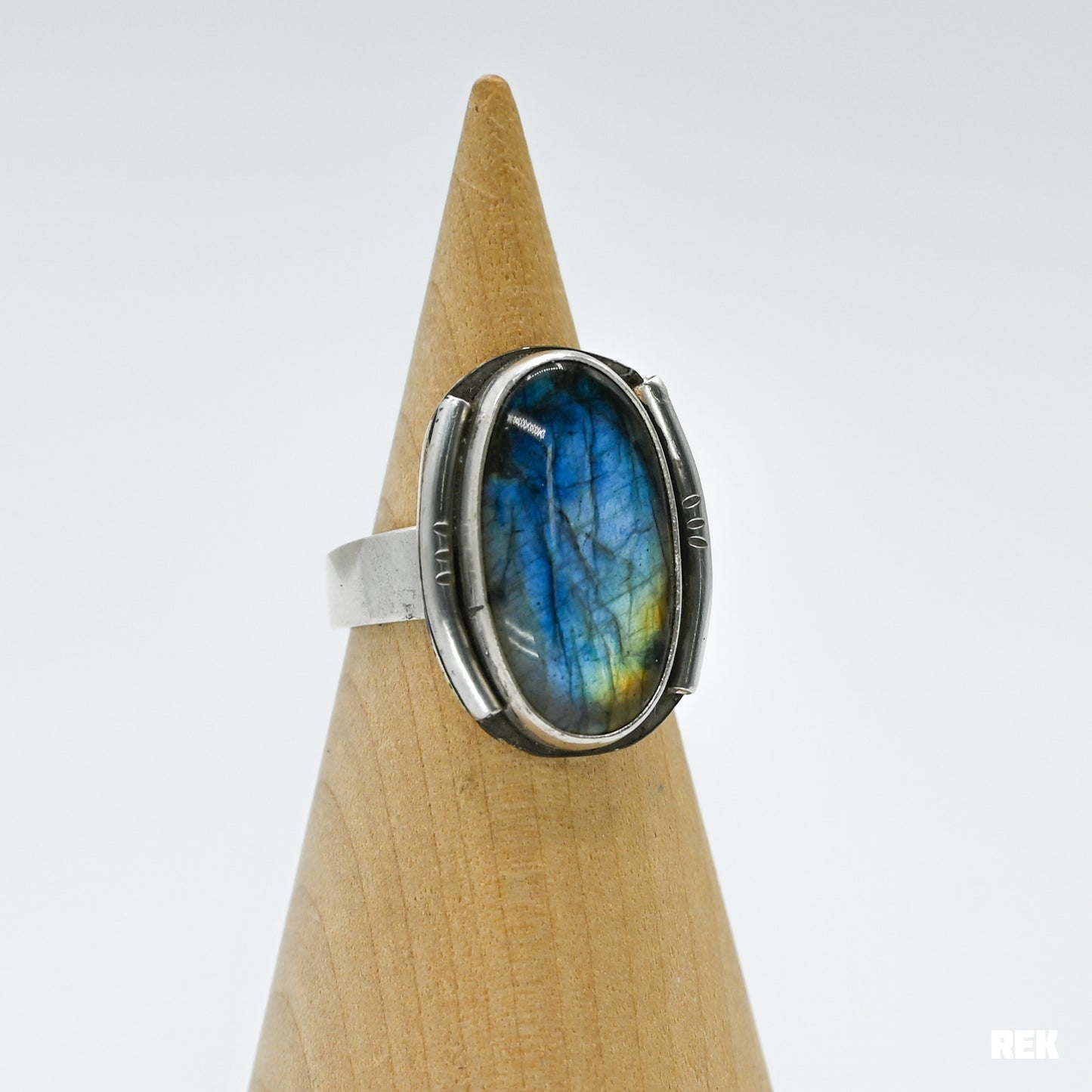 Oval labradorite with silver ornaments size 6.75