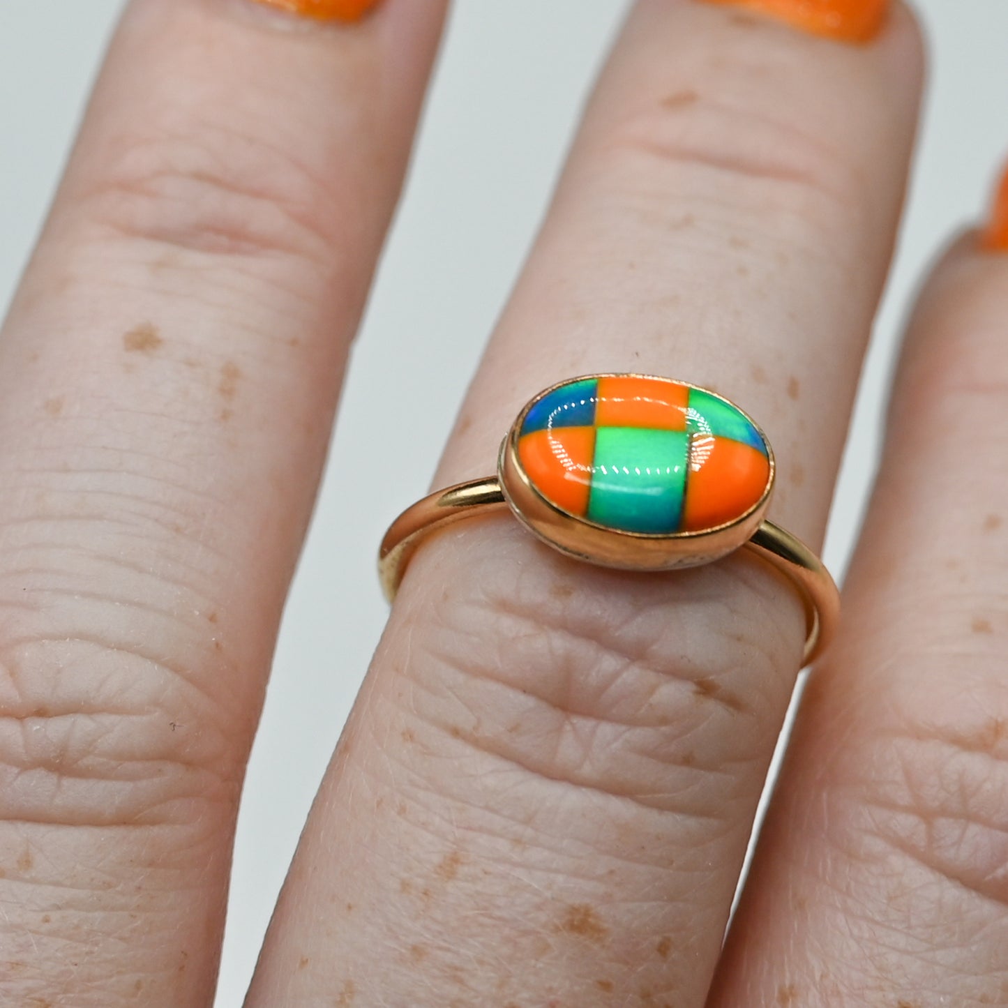 Gold fill horizontal oval checkered aurora opal size 7