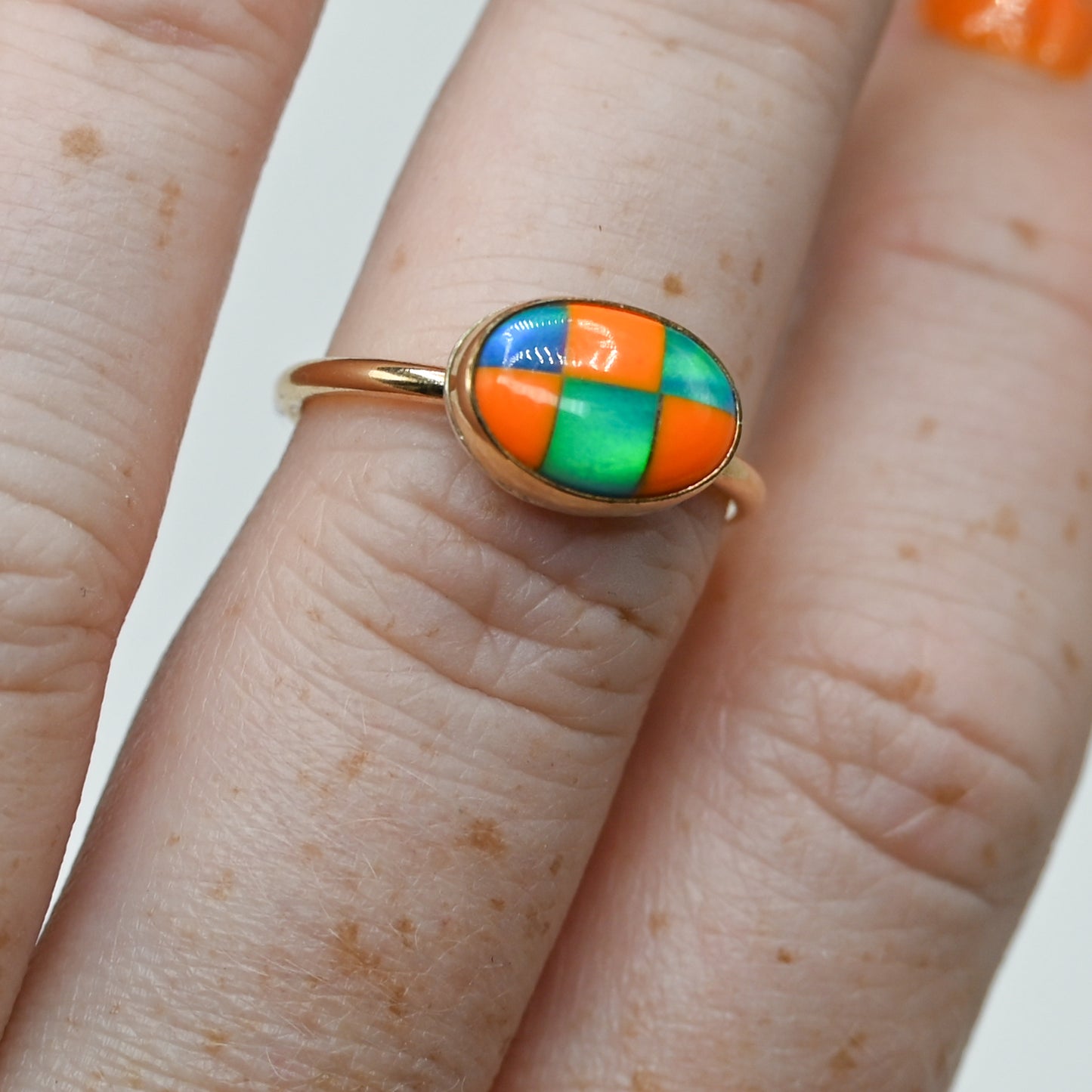 Gold fill horizontal oval checkered aurora opal size 7