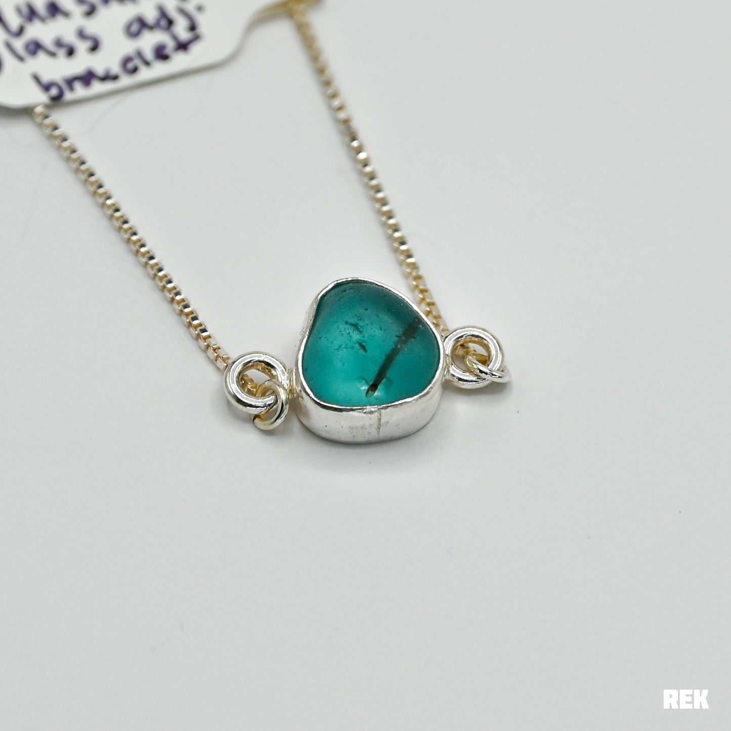 Adjustable bracelet with bright aqua safety sea glass