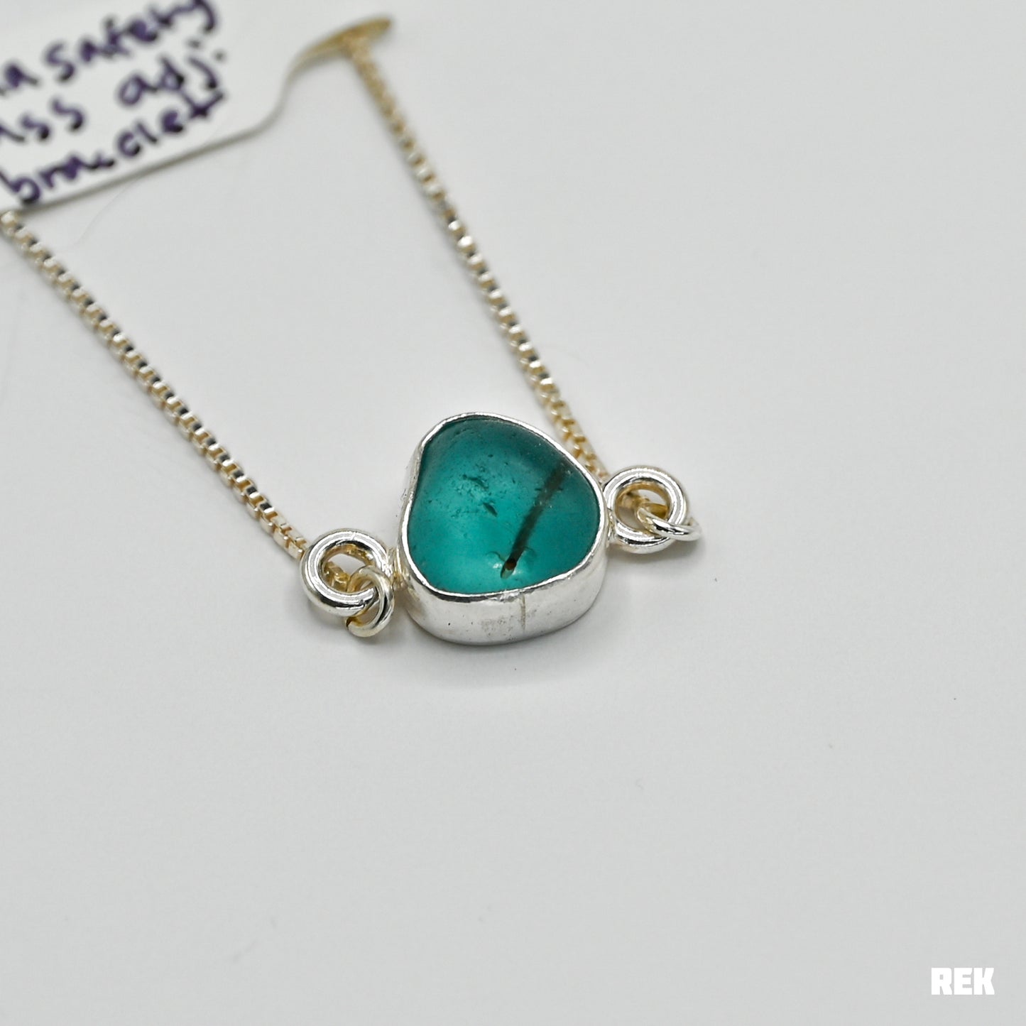 Adjustable bracelet with bright aqua safety sea glass