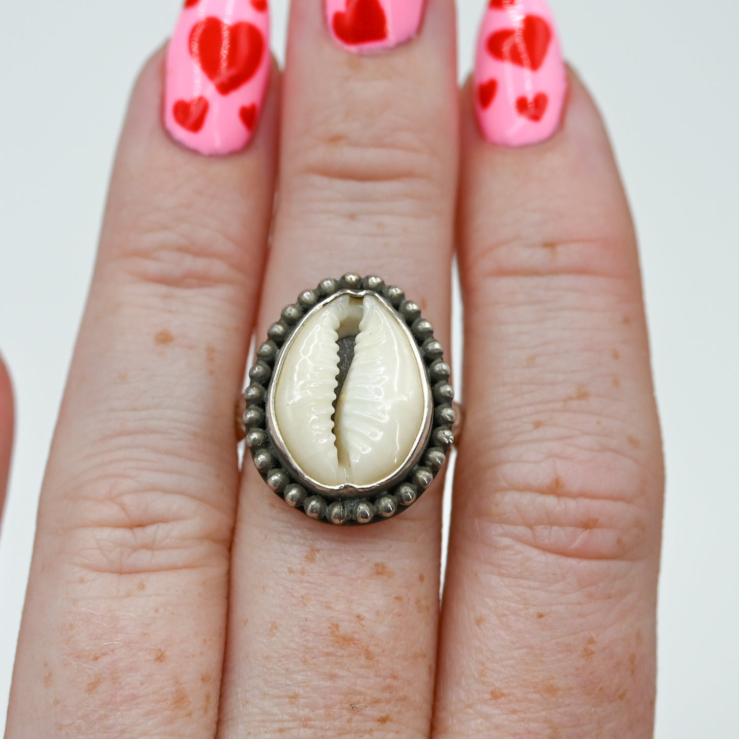 XL cowrie bead around size 7.25