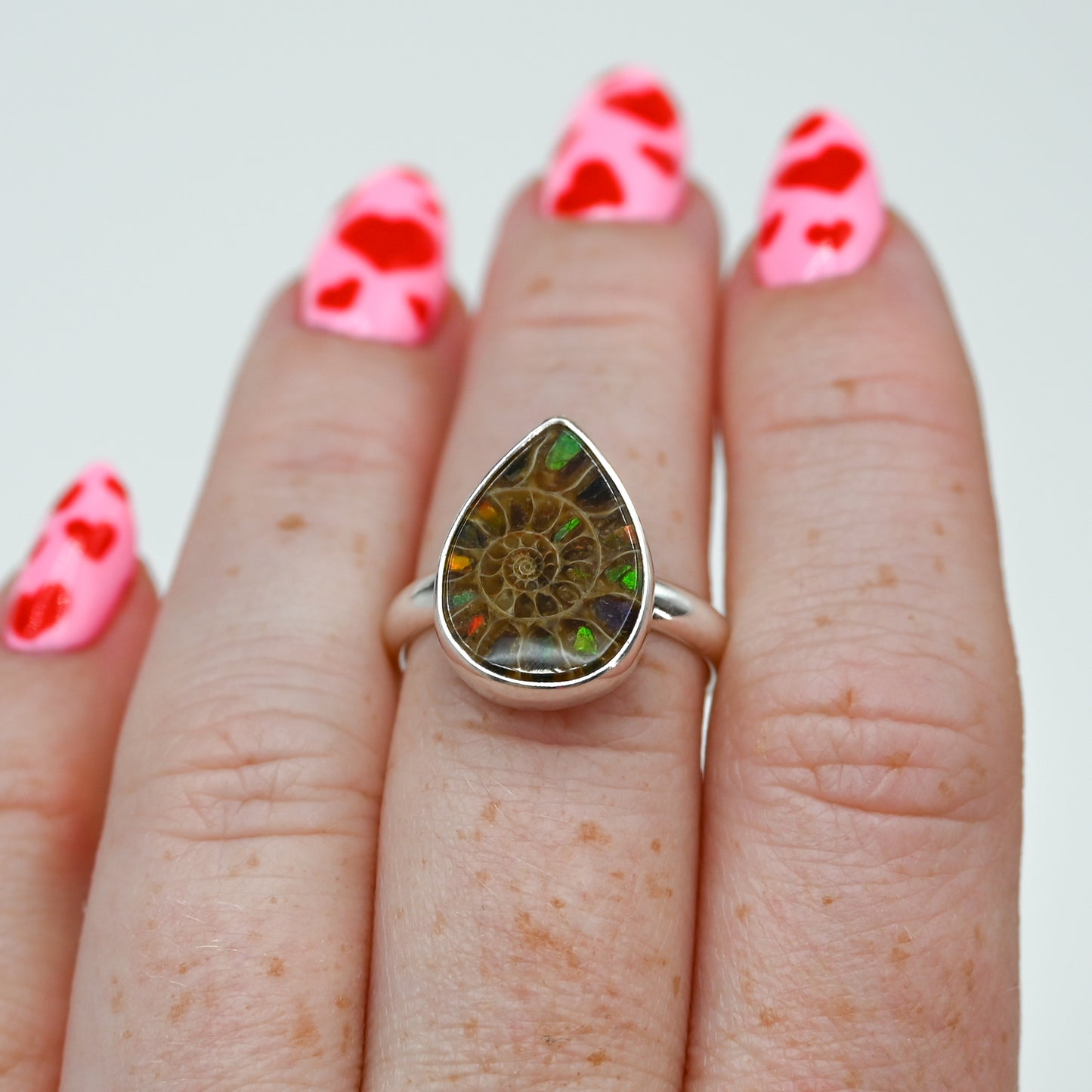 Pear ammonite with ammonite inlay size 7.25