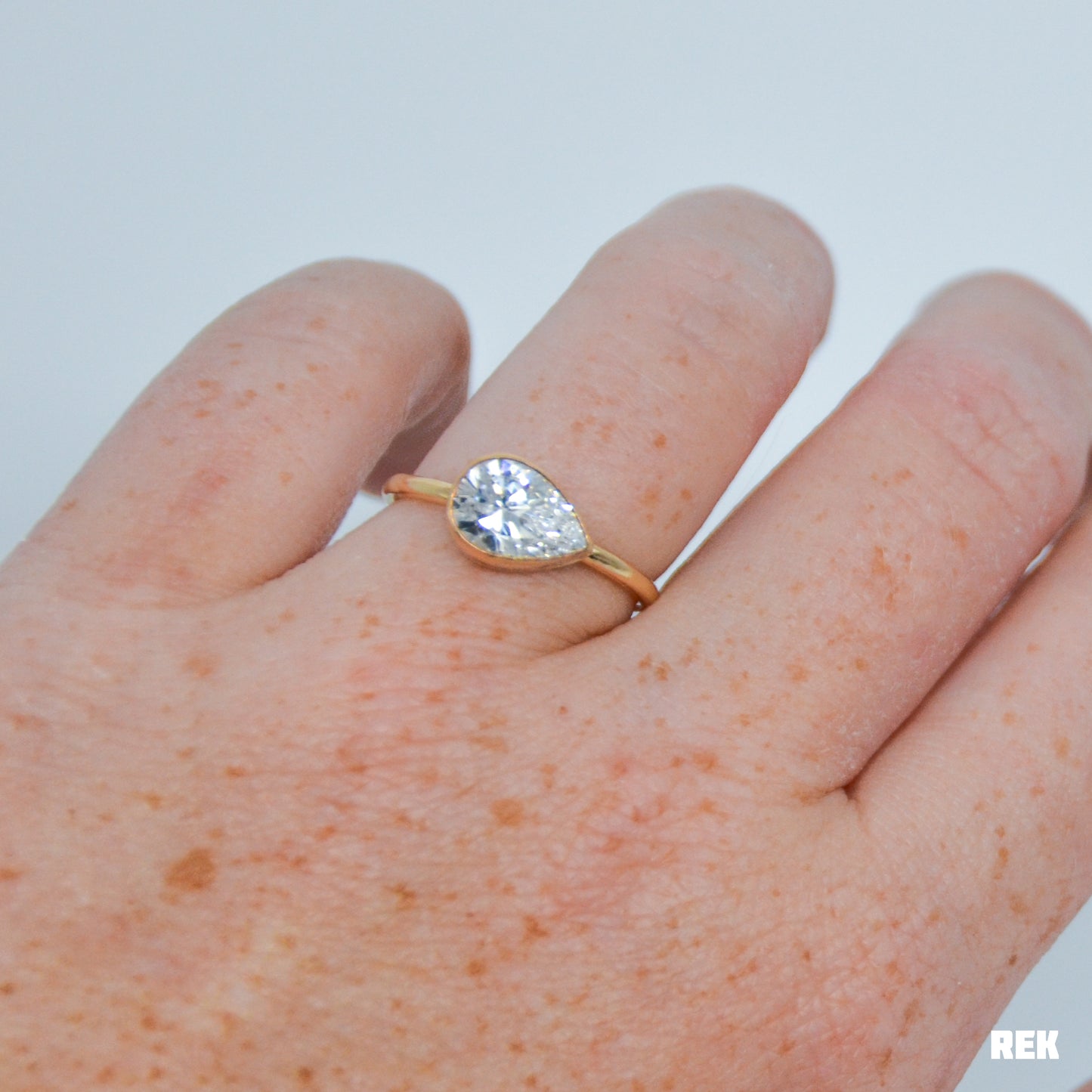 Gold fill horizontal faceted CZ pear size 8