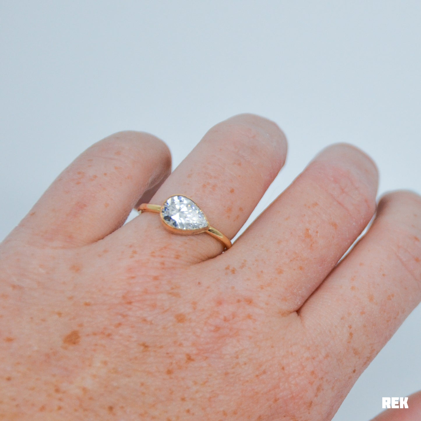 Gold fill horizontal faceted CZ pear size 8