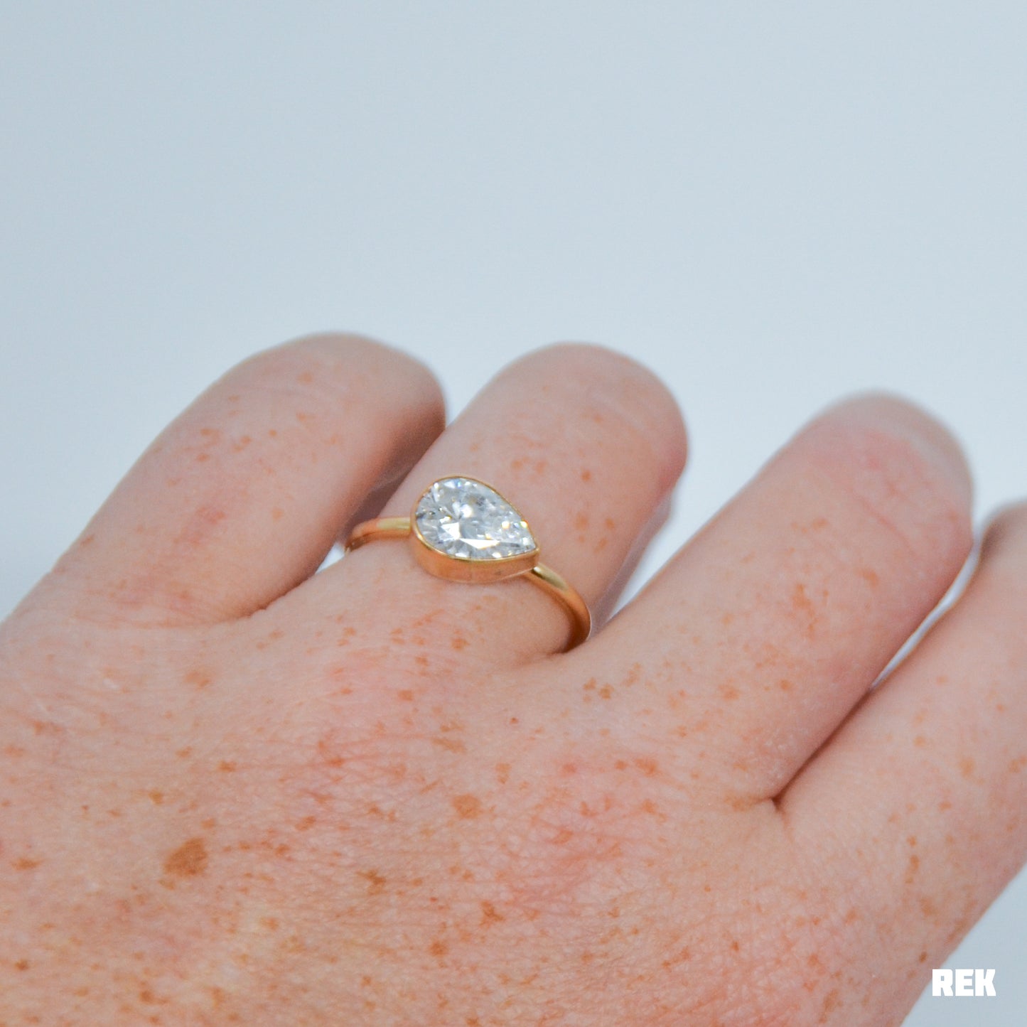 Gold fill horizontal faceted CZ pear size 8