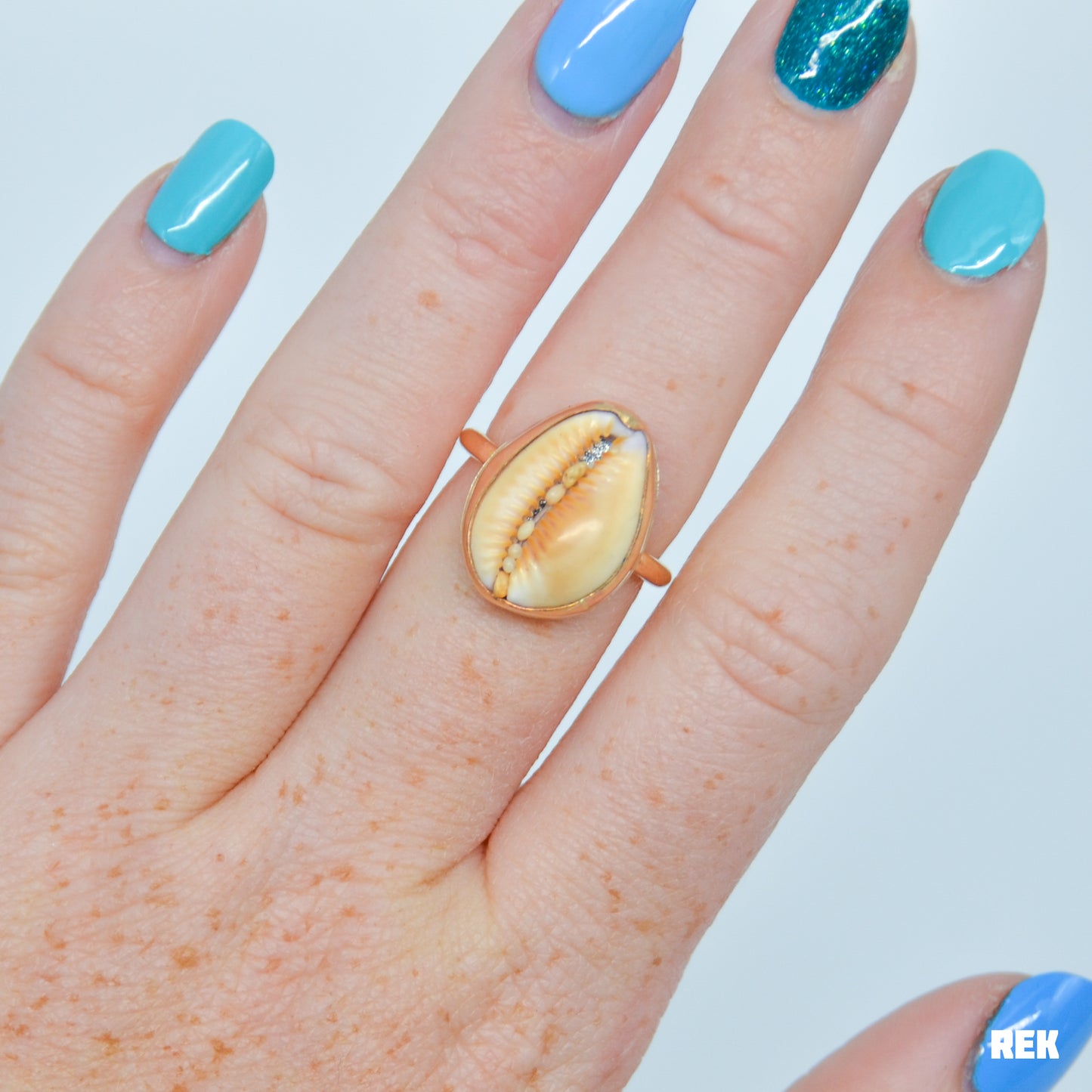 Gold fill cowrie shell size 7