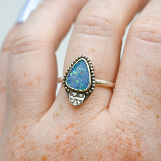 Australian opal with bead wire around and stamped bottom size 7.25