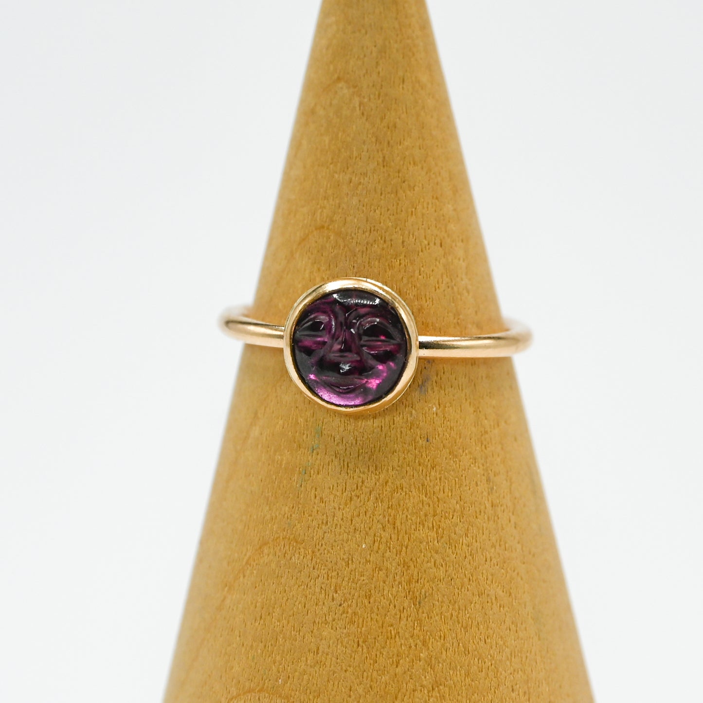 Gold fill garnet carved face size 7