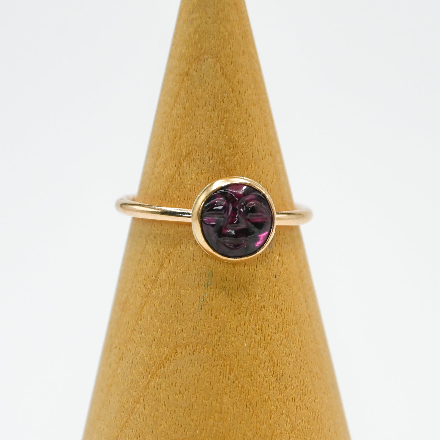 Gold fill garnet carved face size 7
