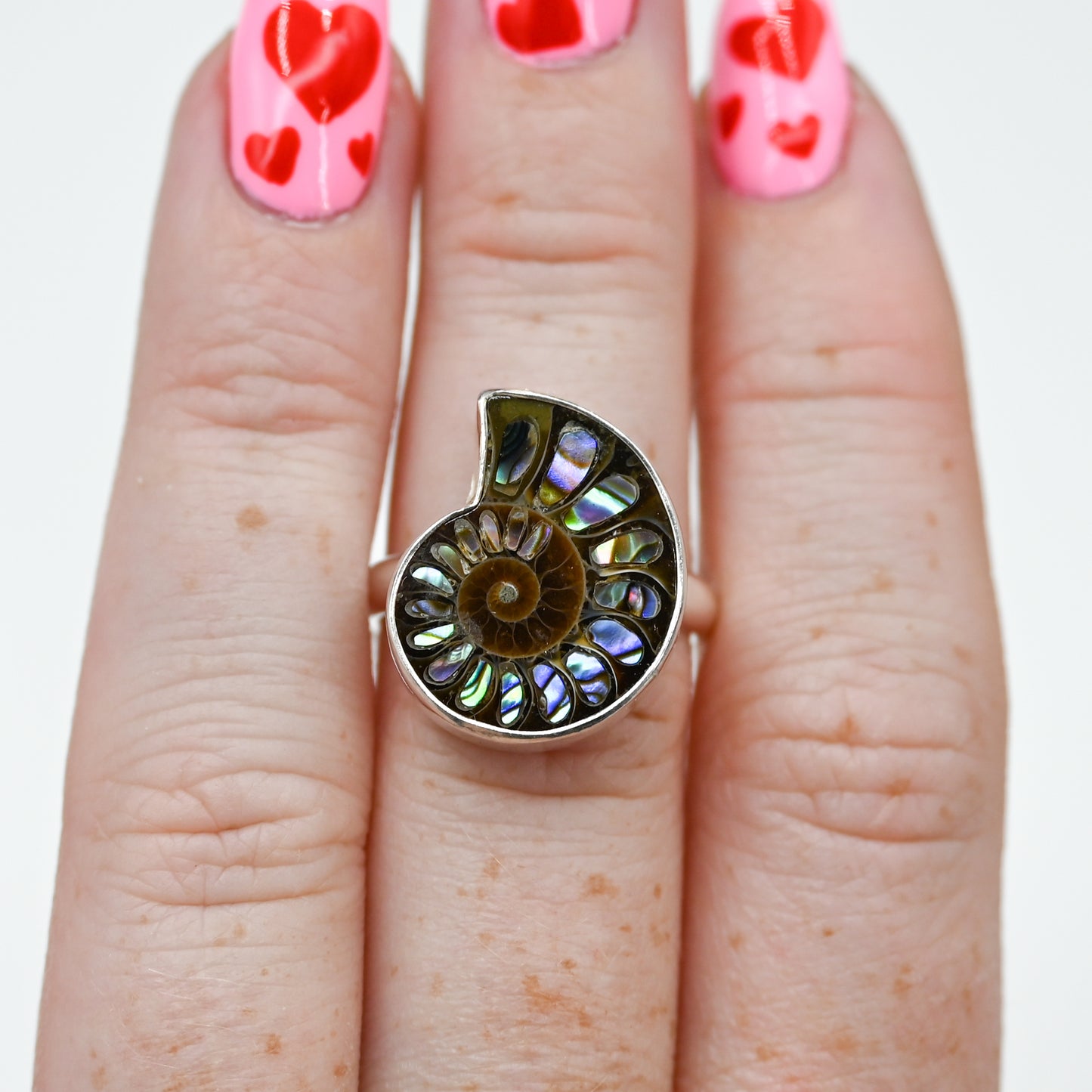 Ammonite with abalone inlay size 7