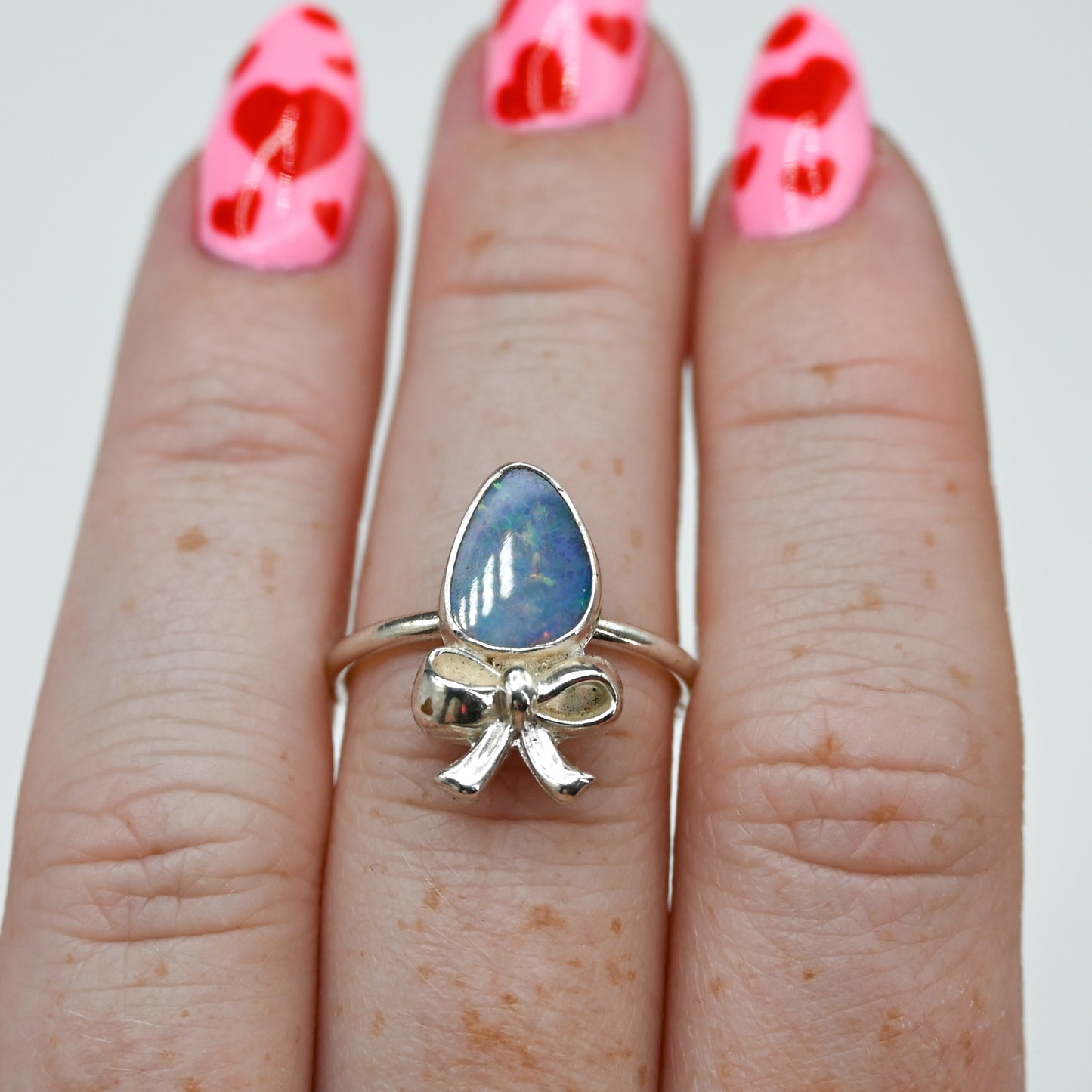 Australian opal and bow size 7