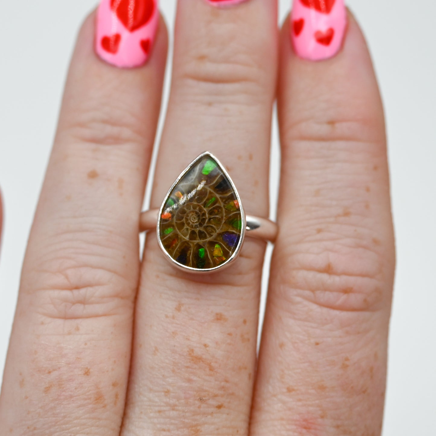 Pear ammonite with ammonite inlay size 7.25