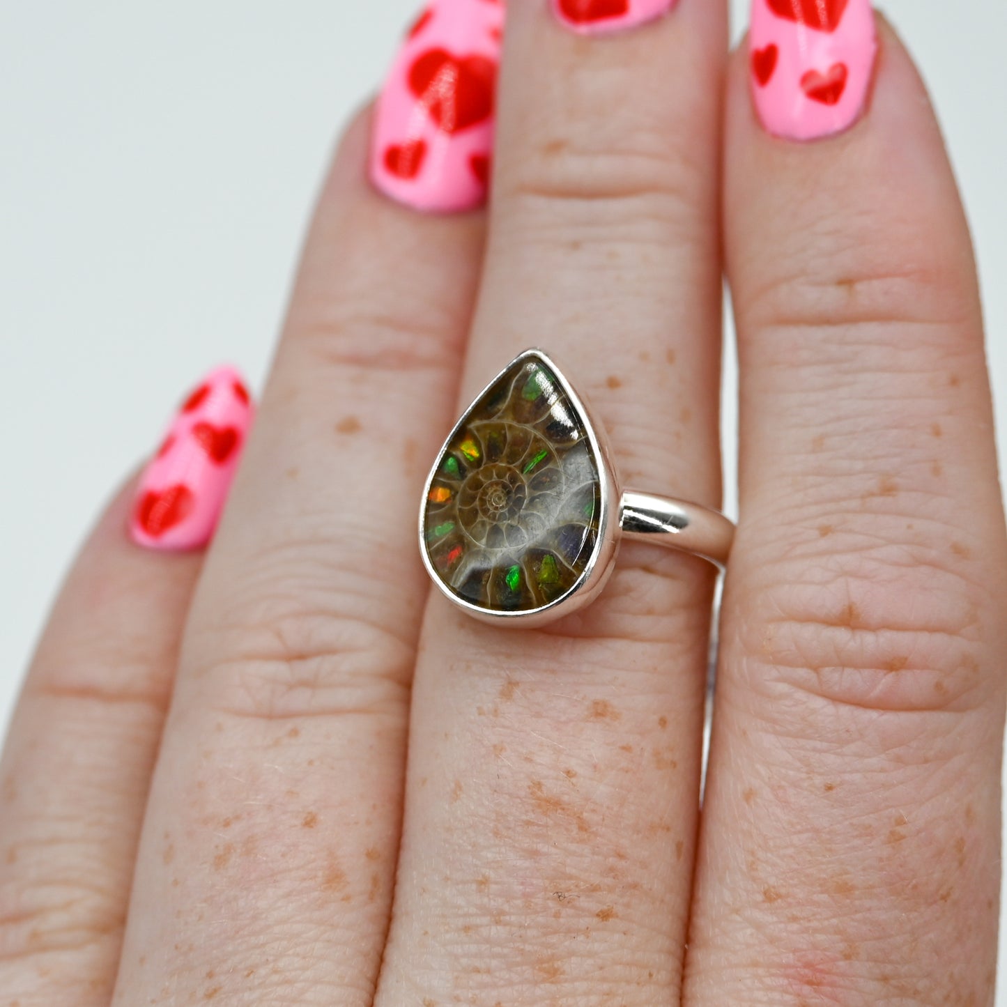 Pear ammonite with ammonite inlay size 7.25