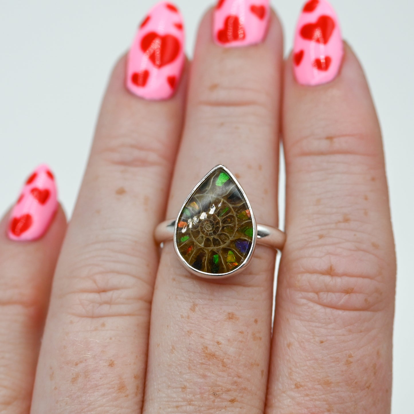 Pear ammonite with ammonite inlay size 7.25
