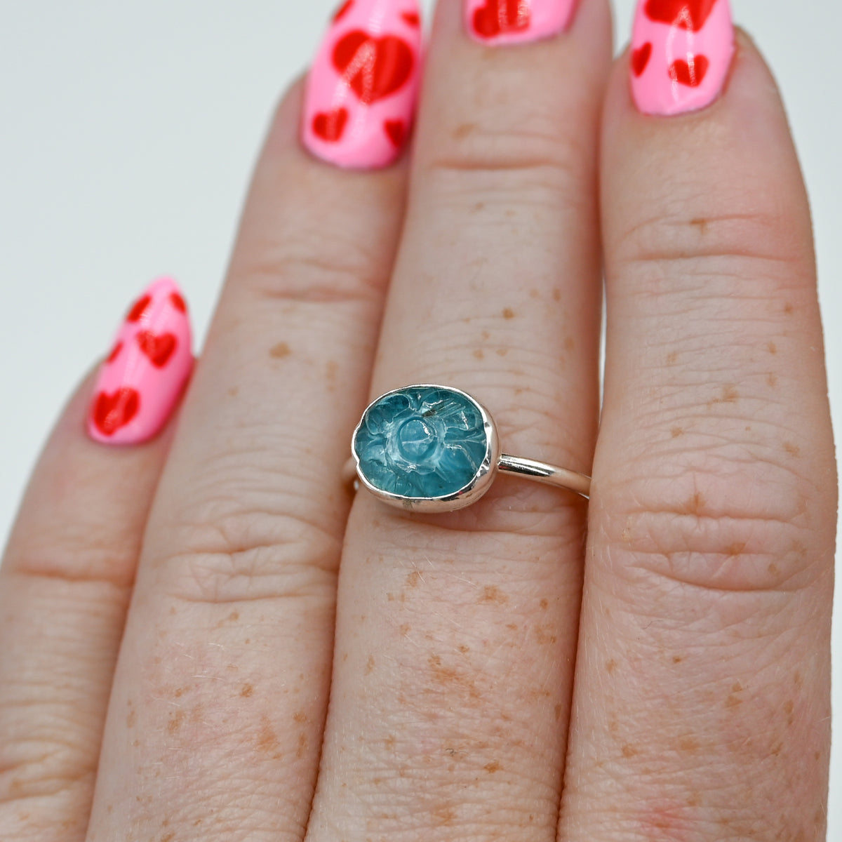Horizontal carved teal kyanite size 7.5