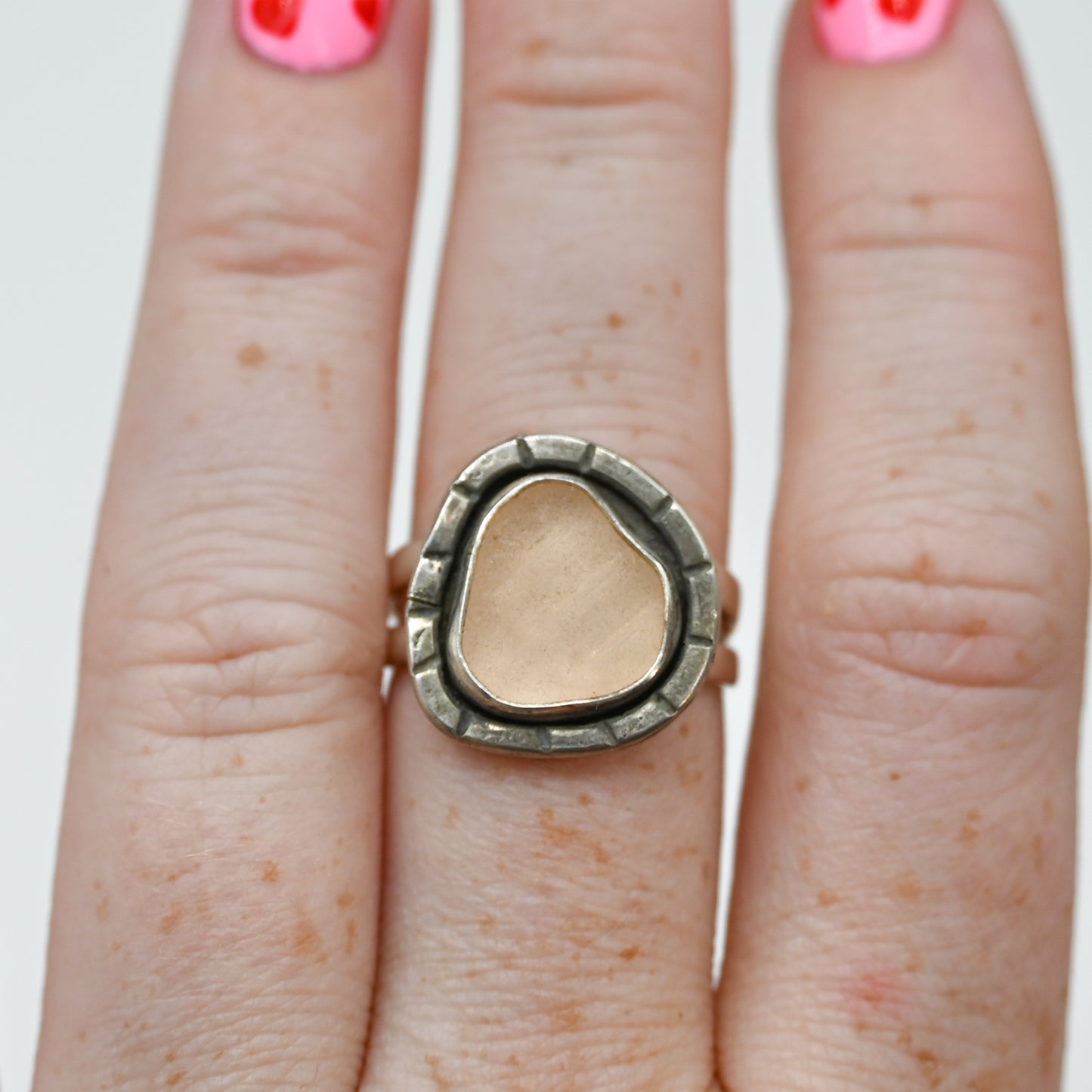 Pink sea glass hammered stamp around size 8